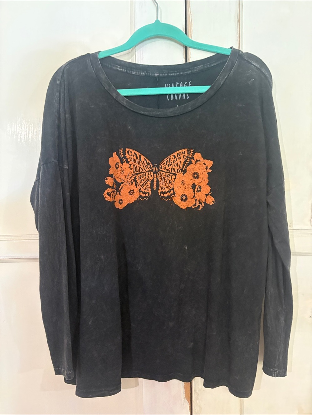 Vintage Canvas Black Long-Sleeve Tee with Orange Butterfly Graphic
